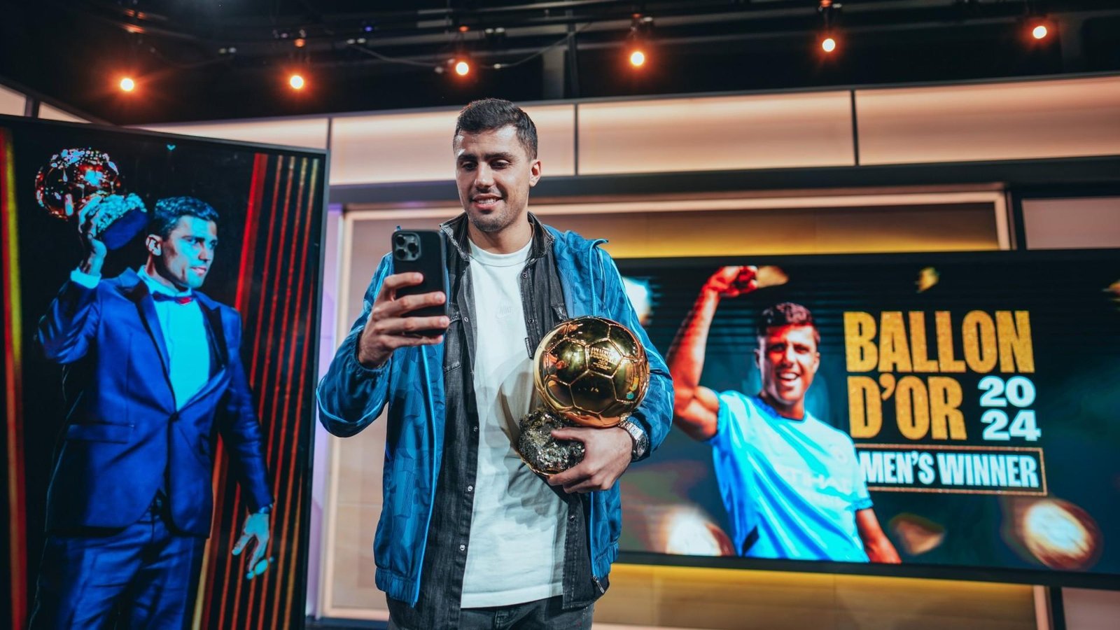 Rodri with the Ballon d'Or trophy - Rodri Family
